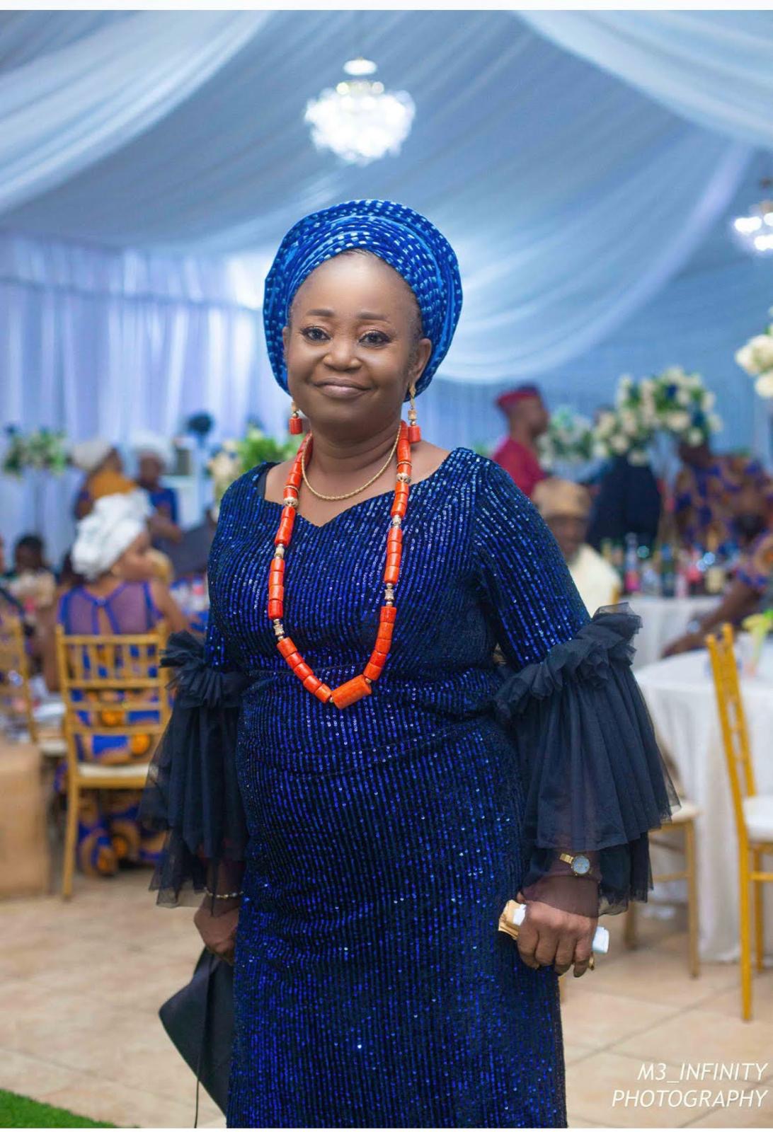 Oludayo Ayobode Olorundara, in a blue gele and coral beads