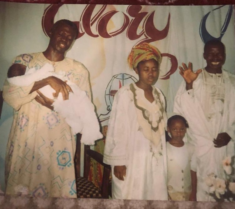 Oludayo Olorundara with her husband at a child's dedication