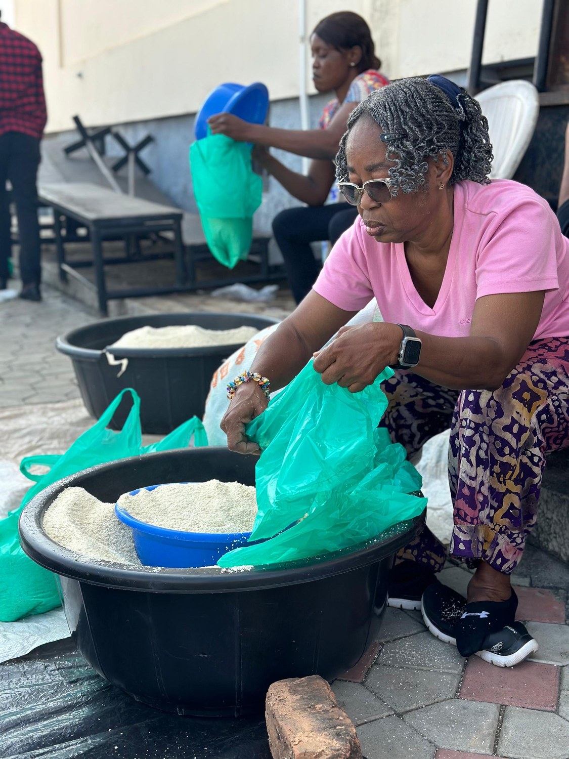 Oludayo Olorundara bagging food for prisoners on missions with her church